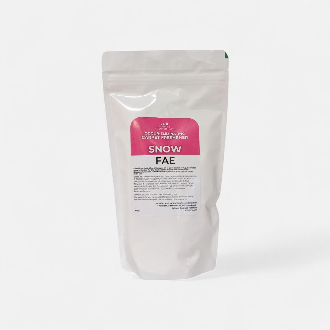 White packaging of Snow Fae carpet freshener on a white background
