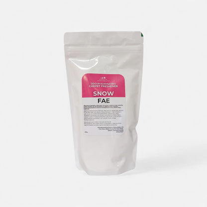 White packaging of Snow Fae carpet freshener on a white background