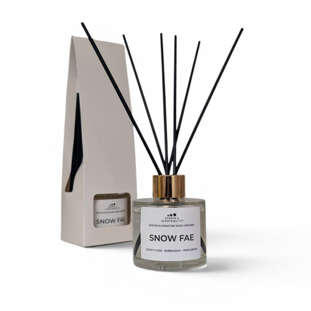 Diffuser bottle labeled 'Snow Fae' with black sticks and packaging on a white background