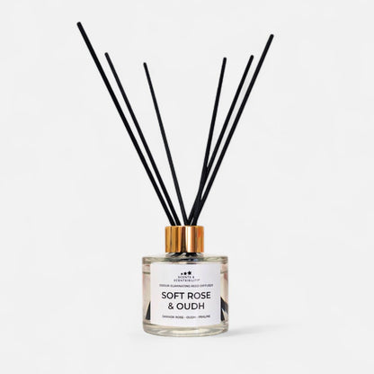 Diffuser with black sticks labeled 'Soft Rose & Oudh' on a white background
