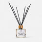Diffuser with black sticks labeled 'Soft Rose & Oudh' on a white background