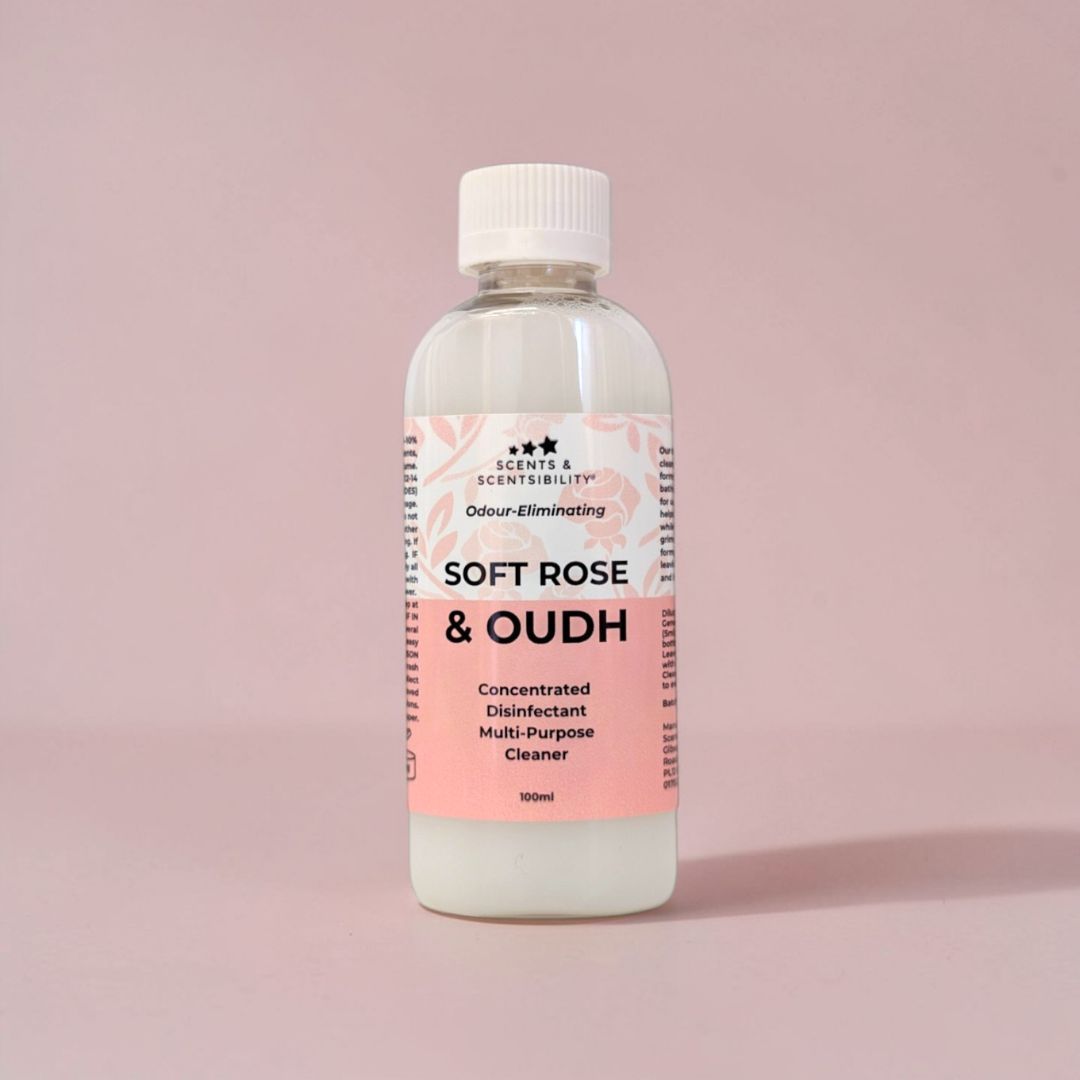 Bottle of 'Soft Rose & Oudh' multi-purpose disinfectant cleaner on a pink background