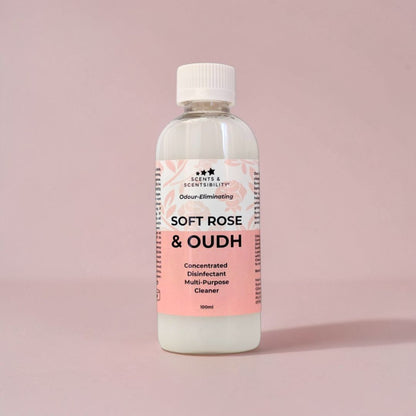 Bottle of 'Soft Rose & Oudh' multi-purpose disinfectant cleaner on a pink background