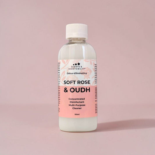 Bottle of 'Soft Rose & Oudh' multi-purpose disinfectant cleaner on a pink background