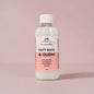 Bottle of 'Soft Rose & Oudh' multi-purpose disinfectant cleaner on a pink background