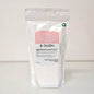 White packaging of a carpet freshener with a pink label on a white background