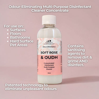 Bottle of 'Soft Rose & Oudh' multi-purpose disinfectant cleaner on a pink background with text about its uses and features.