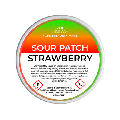 Scented wax melt container labeled 'Sour Patch Strawberry' with warning text on a green background