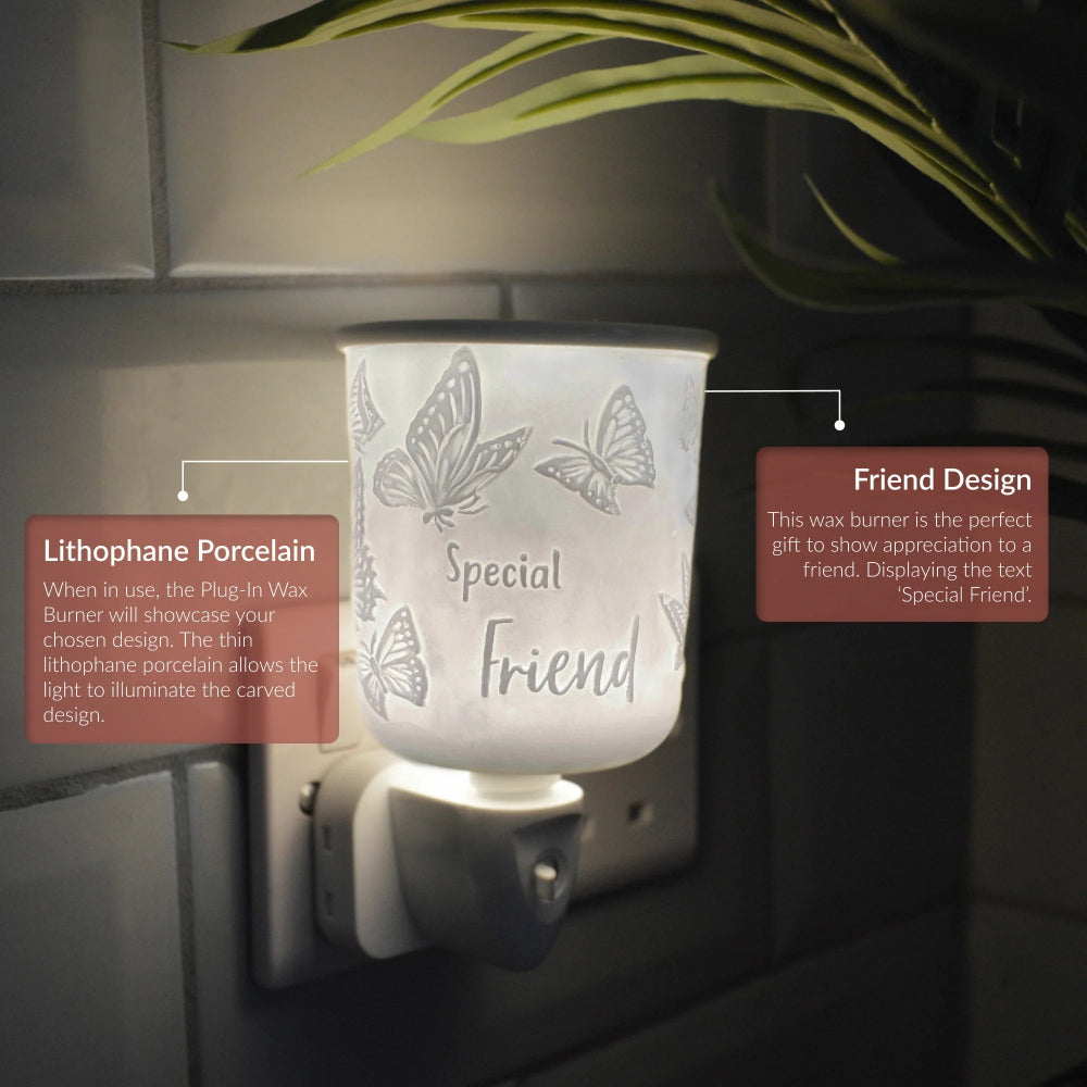 A lit Plug-In Wax Burner night light with a frosted white lithophore porcelain cup featuring butterfly designs and the words 'Special Friend.' The product is shown plugged into a wall outlet against a dark wall, with decorative plant leaves at the top and two callout text boxes explaining features.