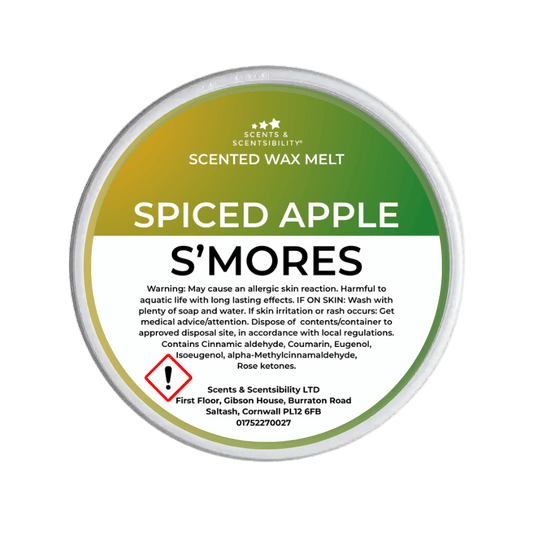 Scented wax melt container labeled 'Spiced Apple S'mores' on a green background