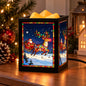 A black cube-shaped wax warmer with a glowing Christmas stained-glass-style print of Santa Claus in a sleigh pulled by a decorated reindeer, shown on a wooden table with holiday lights and ornaments in the background.