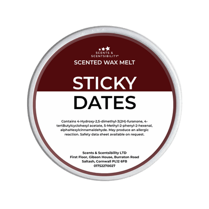 Scented wax melt container labeled 'Sticky Dates' with branding on a green background
