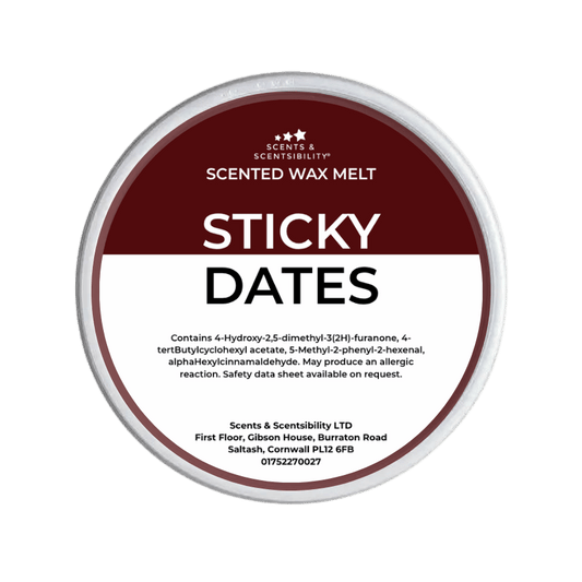 Scented wax melt container labeled 'Sticky Dates' with branding on a green background