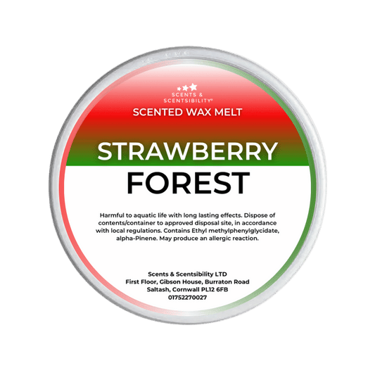 Scented wax melt container labeled 'Strawberry Forest' on a green background