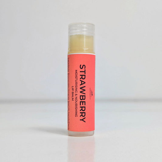 Lip balm with a pink container and black text on a white background