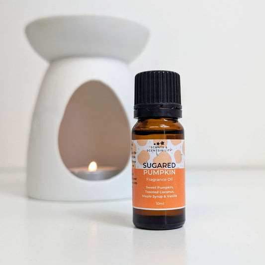 Bottle of Sugared Pumpkin fragrance oil with an oil burner in the background
