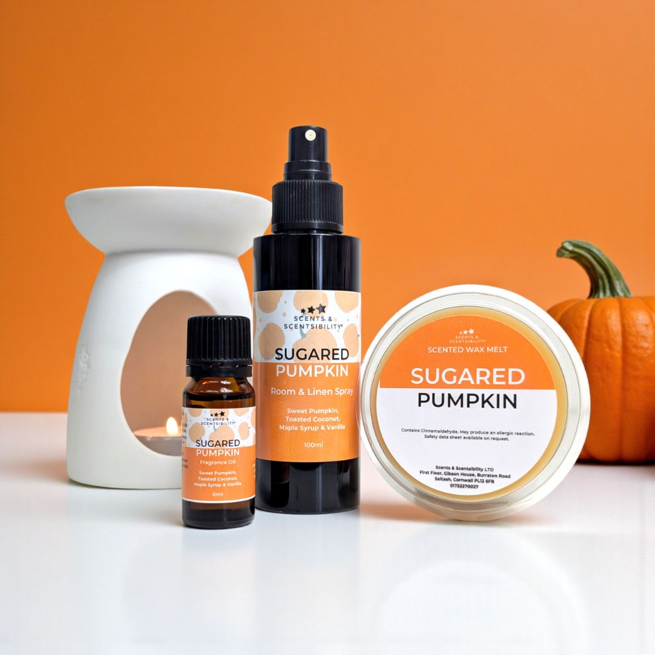 Sugared Pumpkin themed products including a fragrance oil, spray, and wax melt on an orange background.
