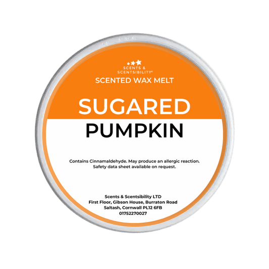 Scented wax melt container labeled 'Sugared Pumpkin' on a green background