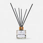 Diffuser bottle labeled 'Sunny Days' with black sticks on a white background