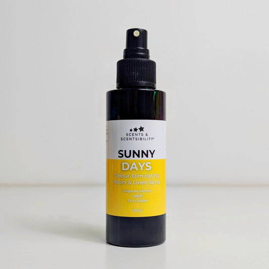 Bottle of 'Sunny Days' room and linen spray with a black and yellow design on a white background.