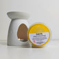 White wax melter with a container labeled 'Sunny Days' on a white background