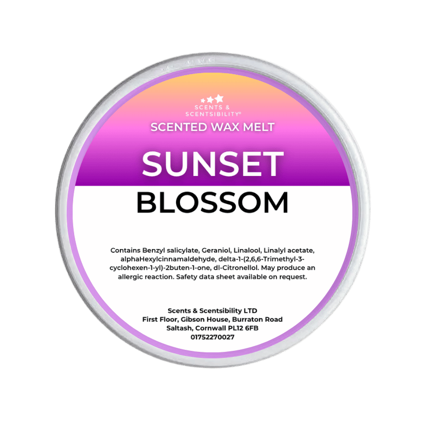 Scented wax melt tin labeled 'Sunset Blossom' on a green background