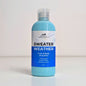 Blue bottle of 'Sweater Weather' face and body smoothie body lotion with a label on a light grey background