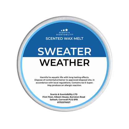 Scented wax melt container labeled 'Sweater Weather' on a green background