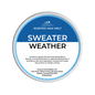 Scented wax melt container labeled 'Sweater Weather' on a green background