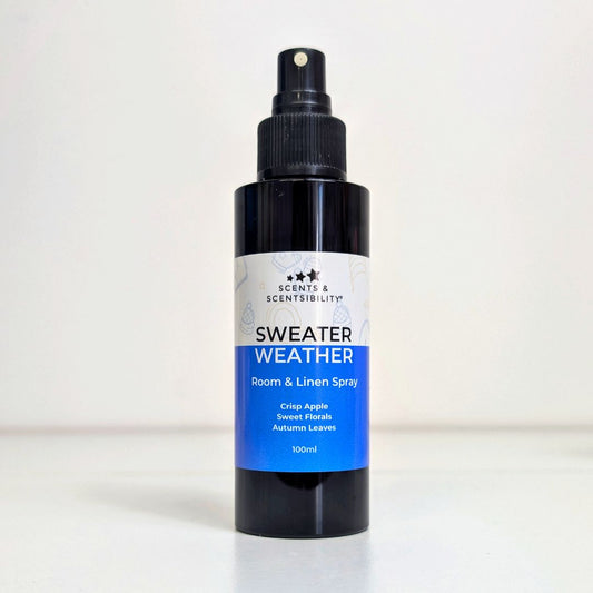 Room and linen spray bottle labeled 'Sweater Weather' on a white background