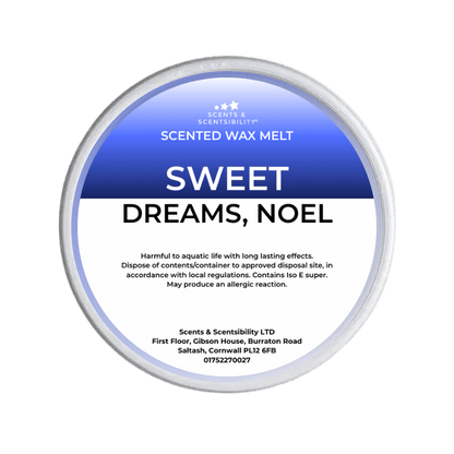 Scented wax melt container labeled 'Sweet Dreams, Noel' on a green background