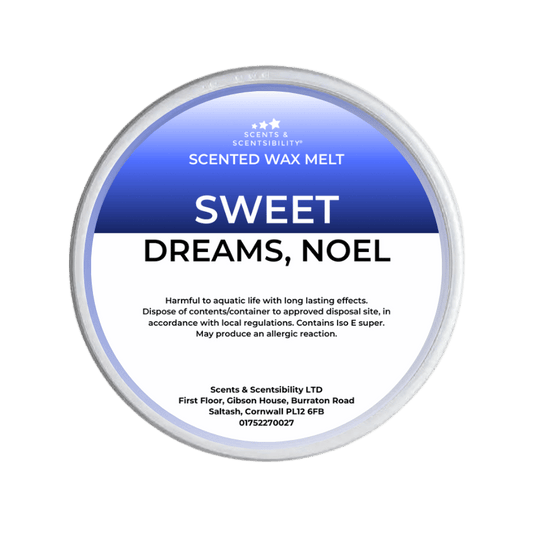 Scented wax melt container labeled 'Sweet Dreams, Noel' on a green background