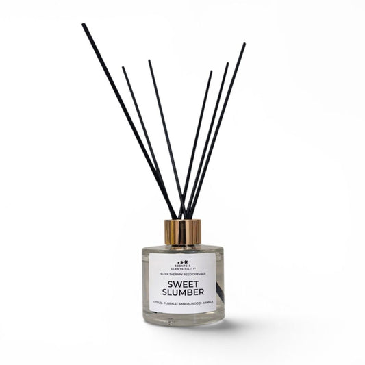 Diffuser with black sticks labeled 'Sweet Slumber' on a white background