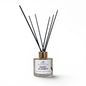 Diffuser with black sticks labeled 'Sweet Slumber' on a white background