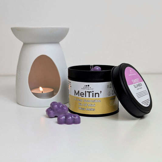 Meltin' wax melts with a ceramic warmer on a white background