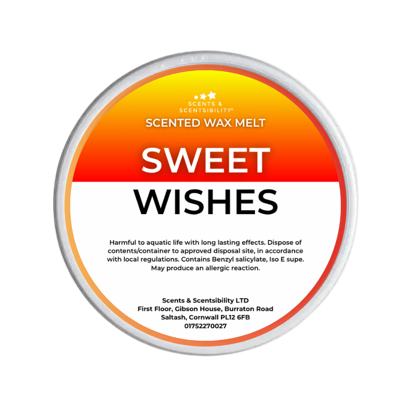 A Scents & Scentsibility 'Sweet Wishes' scented wax melt, featuring a white label with a vibrant orange-to-yellow gradient top section and black text, set against a solid dark green background.