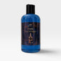 A bottle of blue liquid soap on a white background