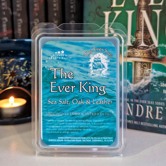 Wax melt packaging labeled 'The Ever King' with a candle and book in the background