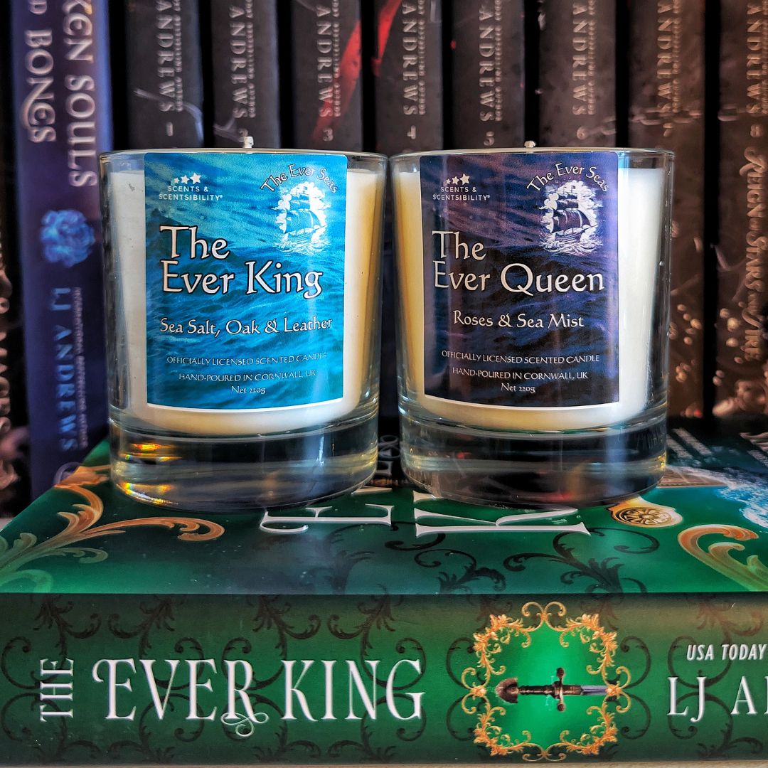 Two candles labeled 'The Ever King' and 'The Ever Queen' on top of a book with similar branding.