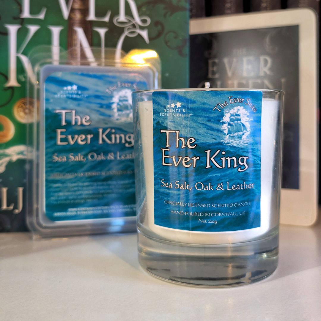 Candle labeled 'The Ever King' with a blue label on a surface.