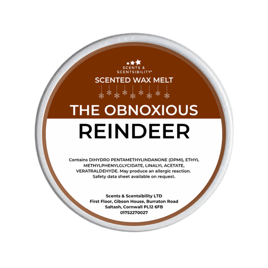 Scented wax melt container labeled 'The Obnoxious Reindeer' on a green background