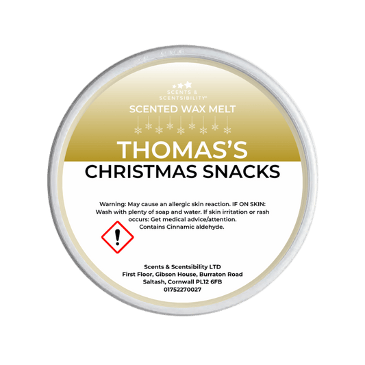 Scented wax melt container labeled 'Thomas's Christmas Snacks' on a green background
