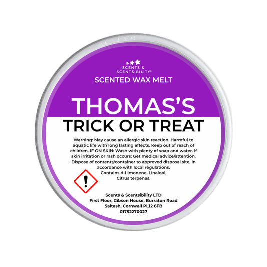 Scented wax melt container labeled 'Thomas's Trick or Treat' on a green background