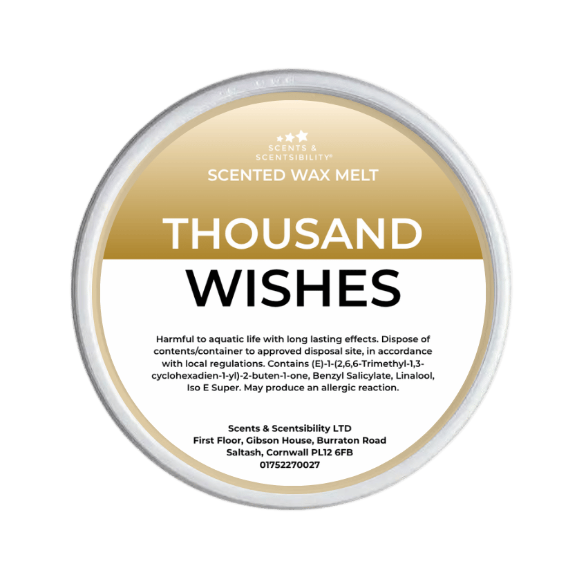 Scented wax melt container labeled 'Thousand Wishes' on a green background