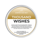 Scented wax melt container labeled 'Thousand Wishes' on a green background