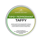 Scented wax melt container labeled 'Tipsy Peppermint Taffy' on a green background