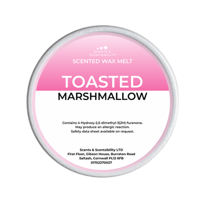 Scented wax melt container labeled 'Toasted Marshmallow' on a green background