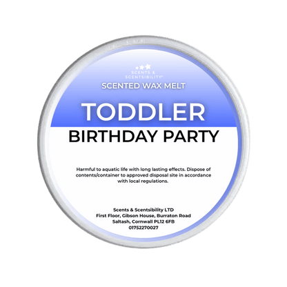 A Scents & Scentsibility 'Toddler Birthday Party' scented wax melt, shown against a solid dark green background.