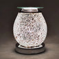 Decorative wax melt warmer with mosaic design on a dark background
