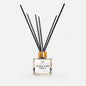 Diffuser with black sticks on a white background